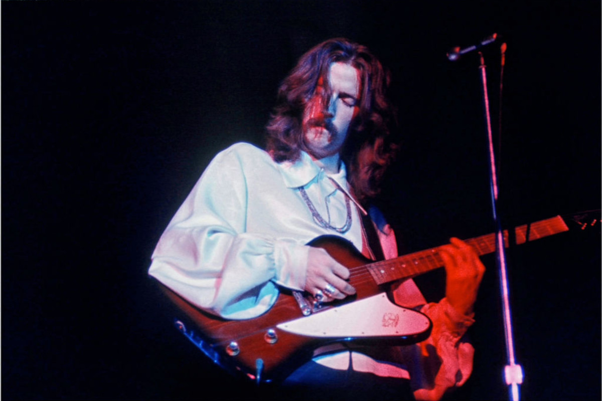 Eric Clapton with his guitar, eyes closed, both hands visible on his guitar, performance at The Forum in Inglewood in 1968