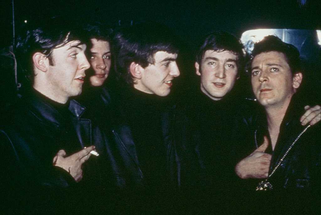 The Beatles with American rock and roll musician Gene Vincent at the Star Club, Hamburg, April-May 1962. Left to right: Paul McCartney, original drummer Pete Best, George Harrison, John Lennon and Vincent