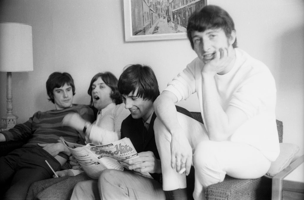 L-R: Ray Davies, Dave Davies, Mick Avory and Peter Quaife of the rock group "The Kinks" relax in their hotel room in August 1965 in New York