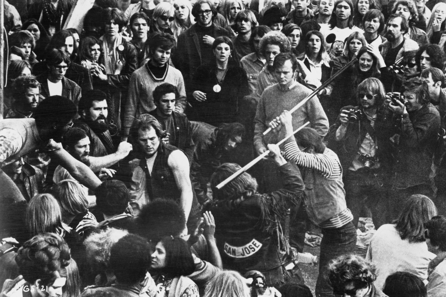 A still from the documentary film 'Gimme Shelter', showing audience members looking on as Hells Angels beat a fan with pool cues at the Altamont Free Concert, Altamont Speedway, California, 6th December 1969