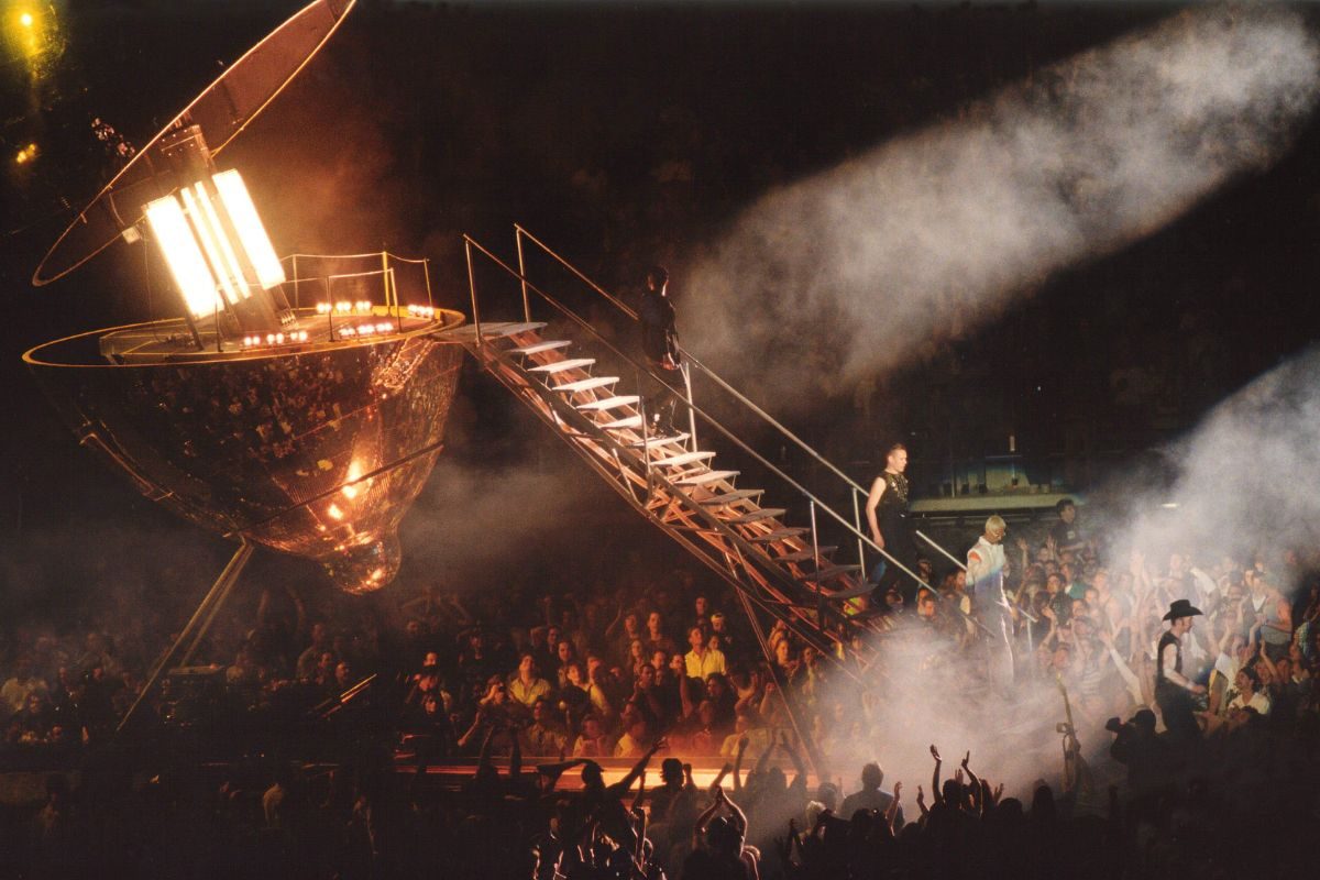 U2 descending from the lemon on the first date of the PopMart tour in Whitney, Nevada, 25 April 1997. L-R Bono, Larry Mullen, Adam Clayton, The Edge