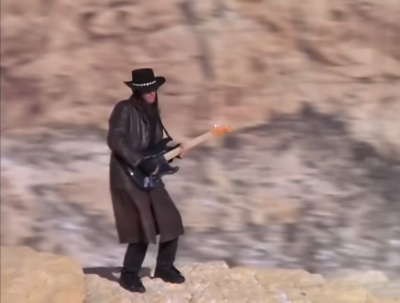 Richie Sambora atop a mountain in the video for Bon Jovi's Bed of Roses