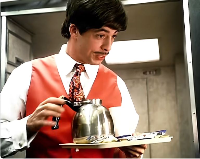 Dave Grohl as an effervescent flight attendant in the video for Foo Fighters' Learn to Fly
