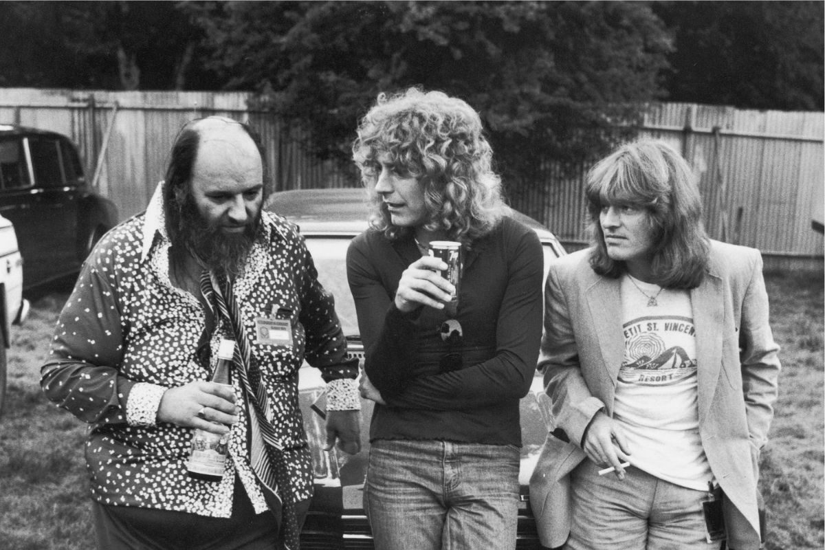 From left, Led Zeppelin’s manager Peter Grant, singer Robert Plant and keyboard player John Paul Jones at the 1979 Knebworth Festival