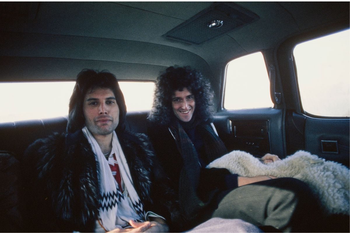Freddie Mercury and Brian May of Queen in the back of a car, 1977