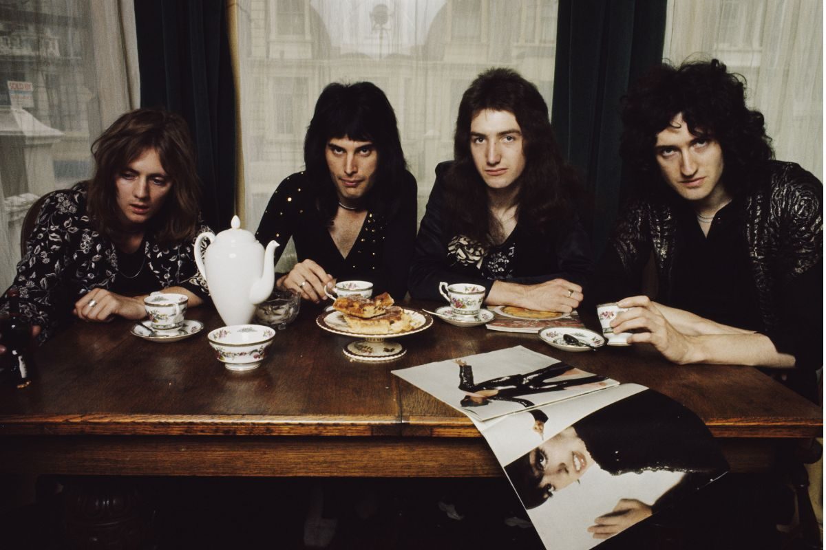 Queen in singer Freddie Mercury's flat, Holland Road, London in early 1974. Left to right: Roger Taylor, Freddie Mercury, John Deacon and Brian May