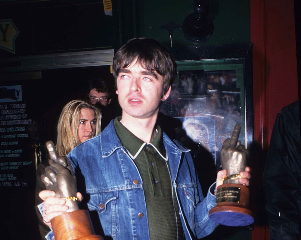 Noel Gallagher of Oasis with Brat Awards in 1996