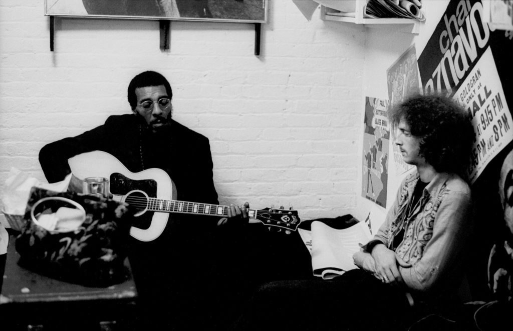 Folk singer Richie Havens and Eric Clapton backstage at the Cafe Au Go Go in Greenwich Village on October 4, 1967 in New York City, New York. 