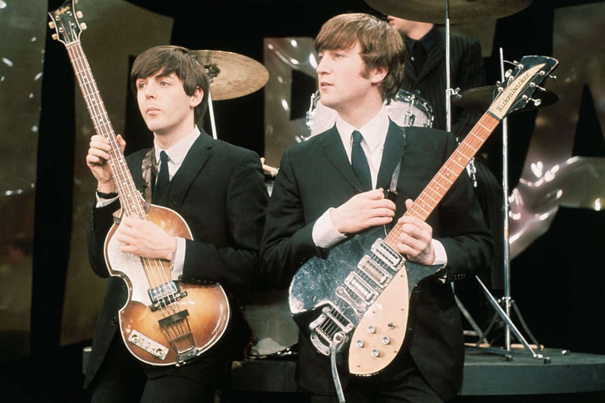 Paul McCartney (left) and John Lennon perform on the set of 'The Ed Sullivan Show', February 8, 1964