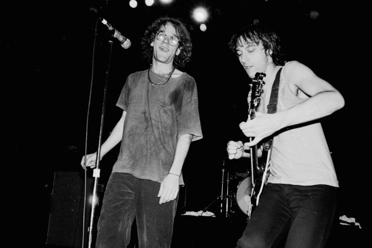 Michael Stipe and Peter Buck performing live onstage with R.E.M, circa 1984