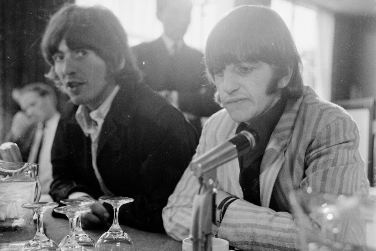 George Harrison and Ringo Starr during a press conference at London Airport held on the group's return from Manila, July 1966