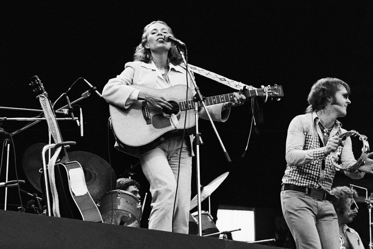 Joni Mitchell performing live on stage with Tom Scott at Wembley Stadium, 14th September 1974