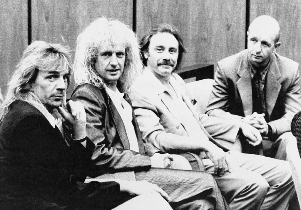 Judas Priest members (l-r) Glenn Tipton, K.K. Downing, Ian Hill, and Rob Halford kick back during a break in the trial in Reno, July 1990