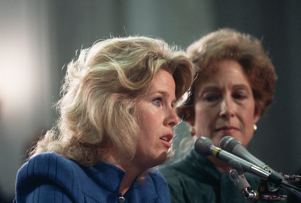 Tipper Gore (left), wife of Tennessee senator Al Gore, testifies before a Senate committee discussing government regulation of objectionable music lyrics, May 1985. Susan Baker, wife of government official James Baker, listens at right