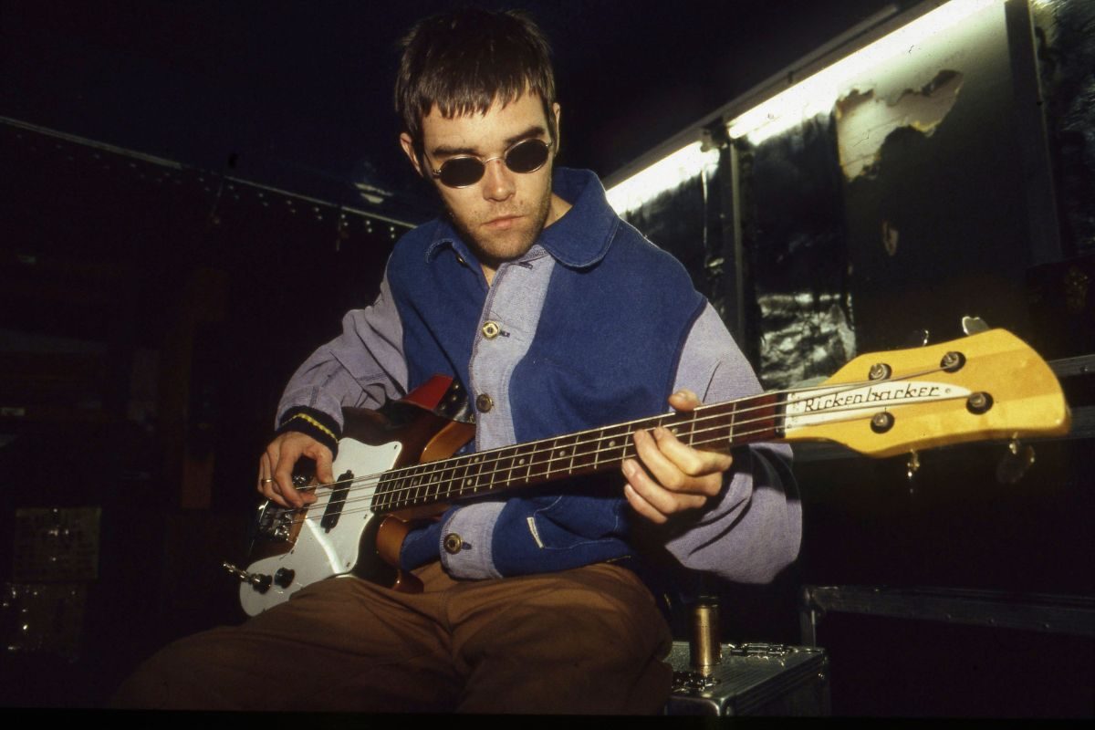 Stone Roses singer Ian Brown playing guitar in rehearsals, 1994