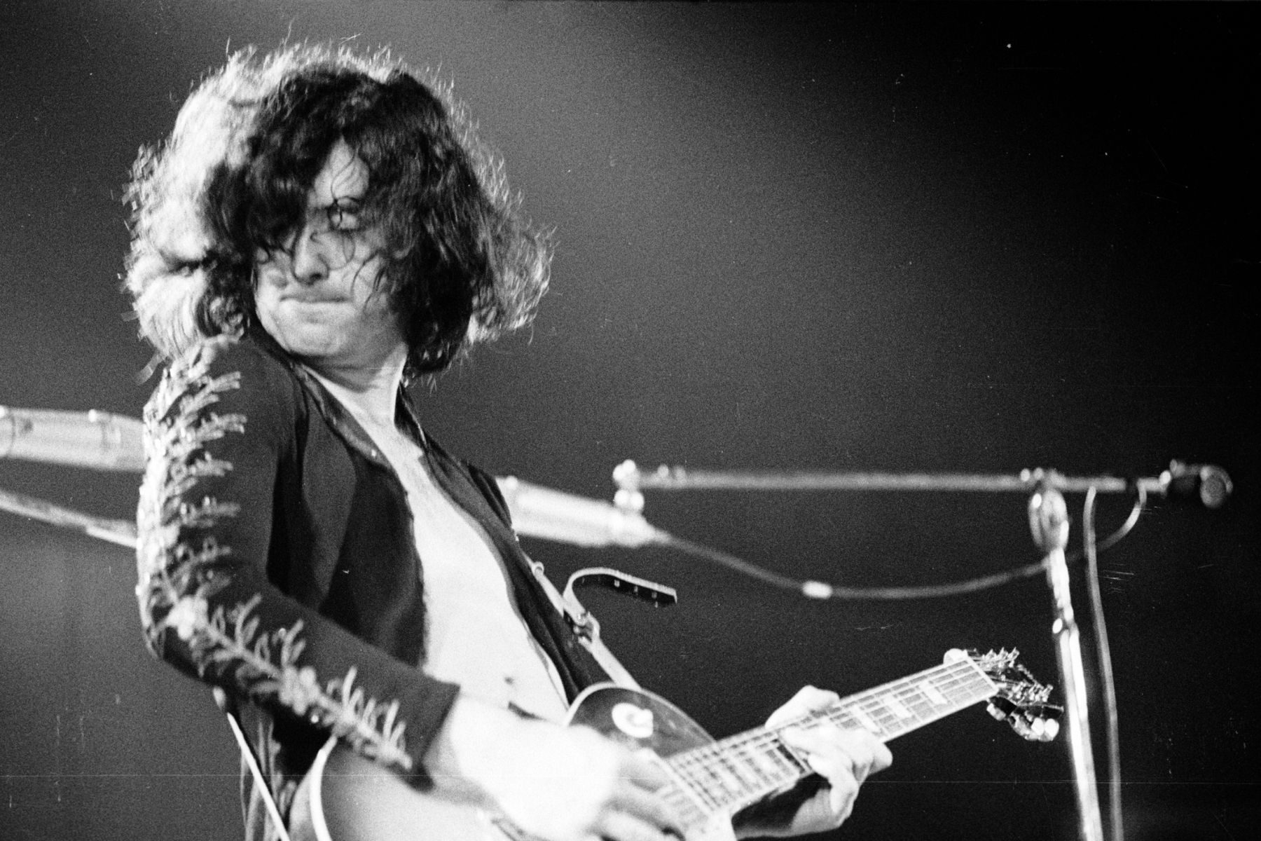 Jimmy Page of Led Zeppelin lost in a riff, 1970
