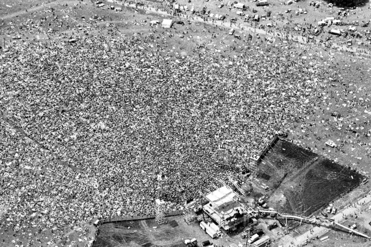 An aerial view of the crowd and stage at the Woodstock Music and Art Fair in White Lake, New York on August 17, 1969