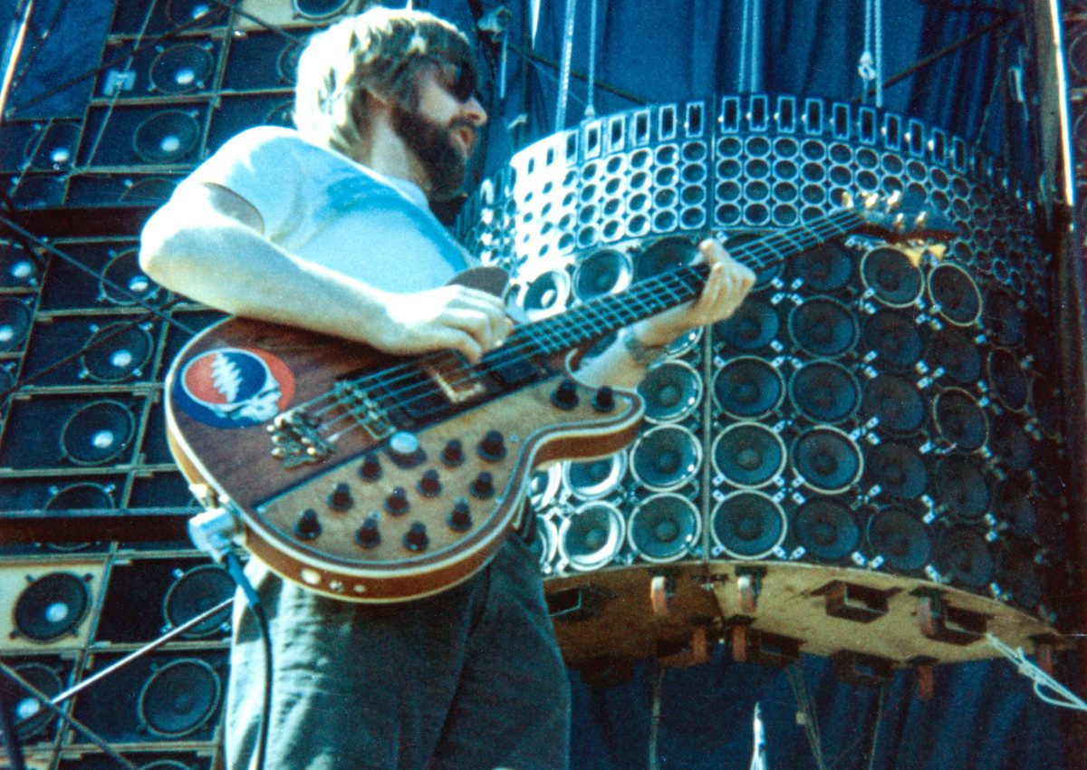 Phil Lesh of the Grateful Dead performs in front of the 'Wall Of Sound' in May 1974 in Santa Barbara, California
