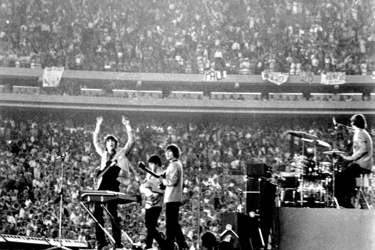 The Beatles perform at Shea Stadium, New York on 15th August 1965