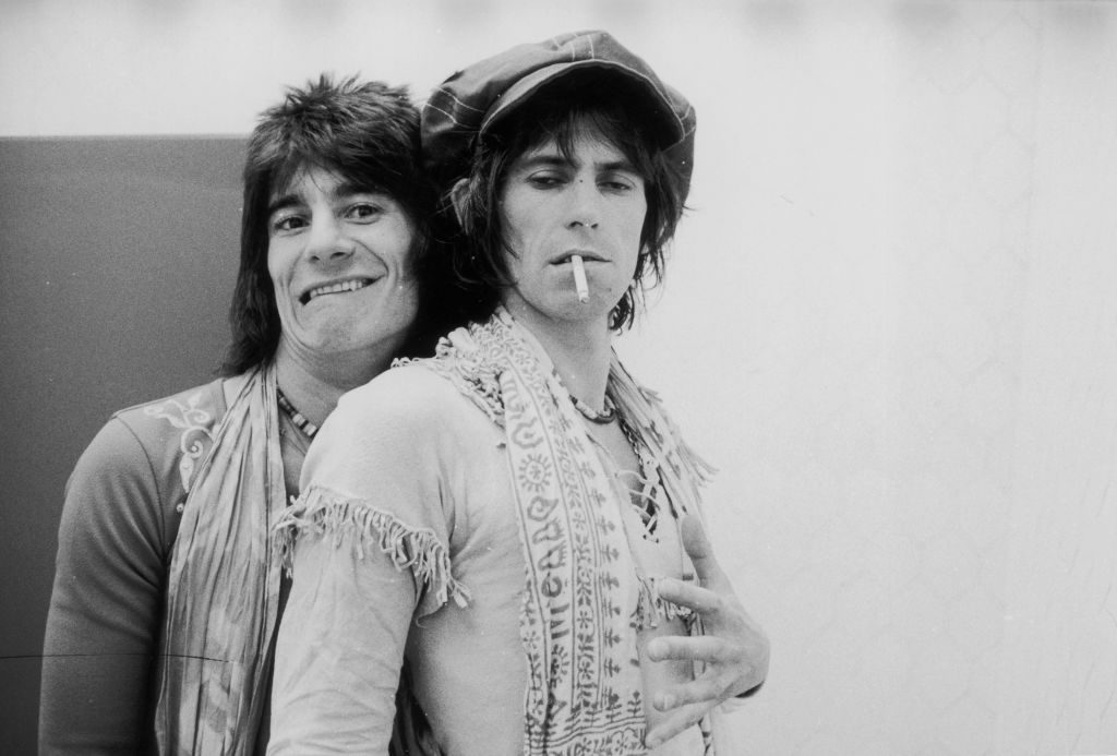 Guitarist Ron Wood (left) embraces his elegantly wasted colleague Keith Richards backstage during the Rolling Stones' 1975 Tour of the Americas