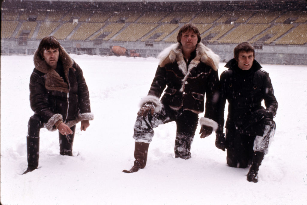 English progressive rock group Emerson Lake and Palmer during rehearsals for the band's 'Works' tour, at the Olympic Stadium, Montreal, Canada, February 1977. Left to right: keyboard player Keith Emerson, guitarist Greg Lake and drummer Carl Palmer