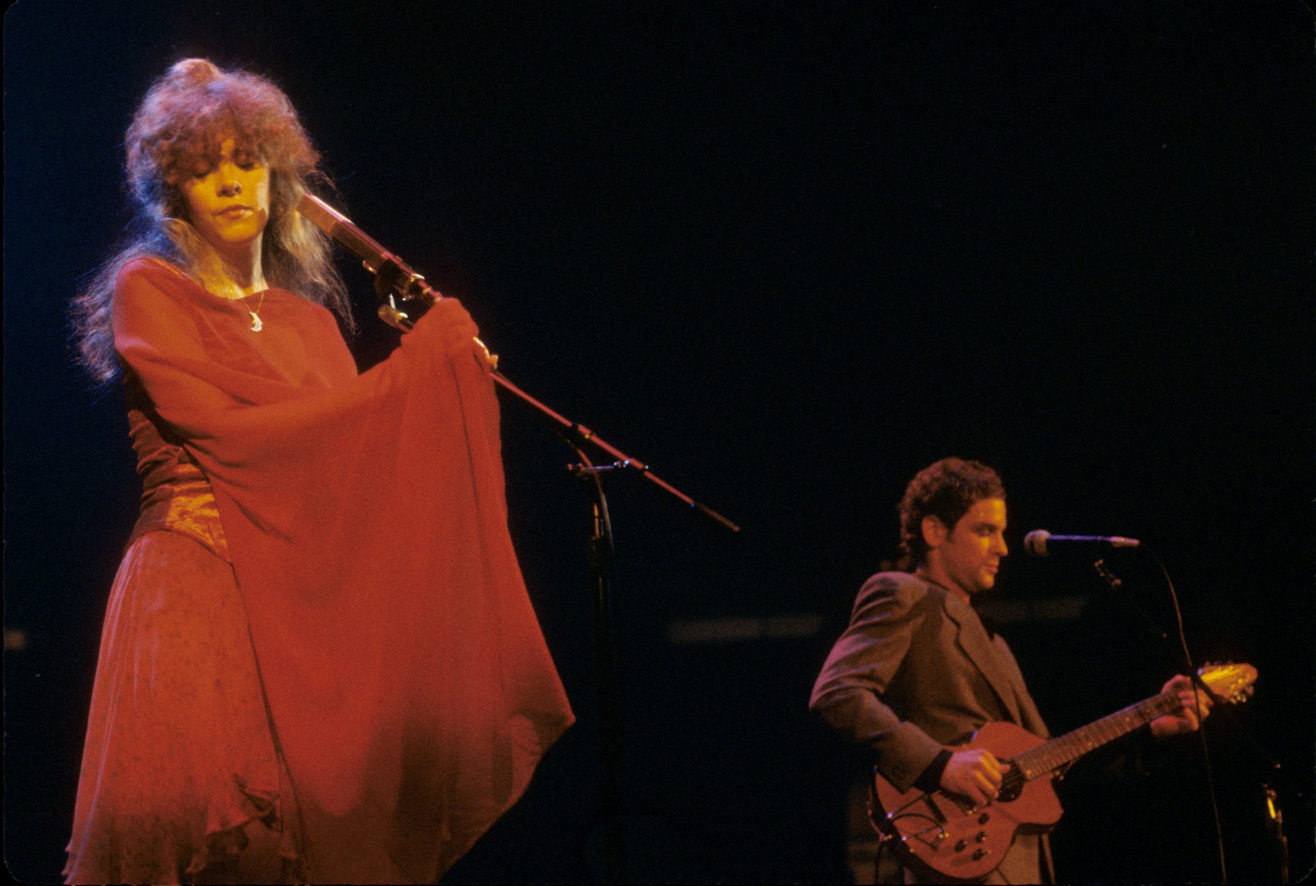 Lindsey Buckingham and Stevie Nicks performing on stage