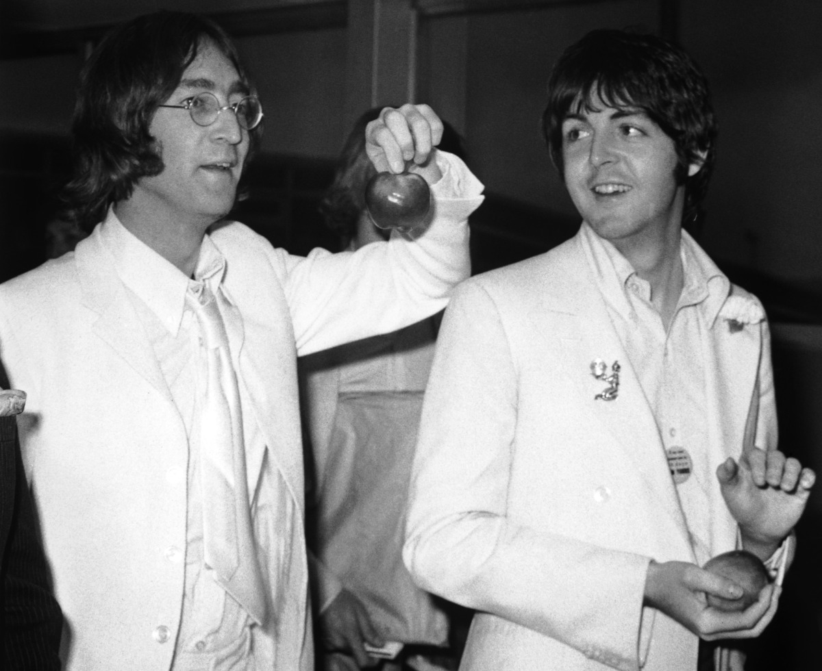 Beatles John Lennon and Paul McCartney at London Airport after a trip to America to promote their new company Apple Corps, 16th May 1968