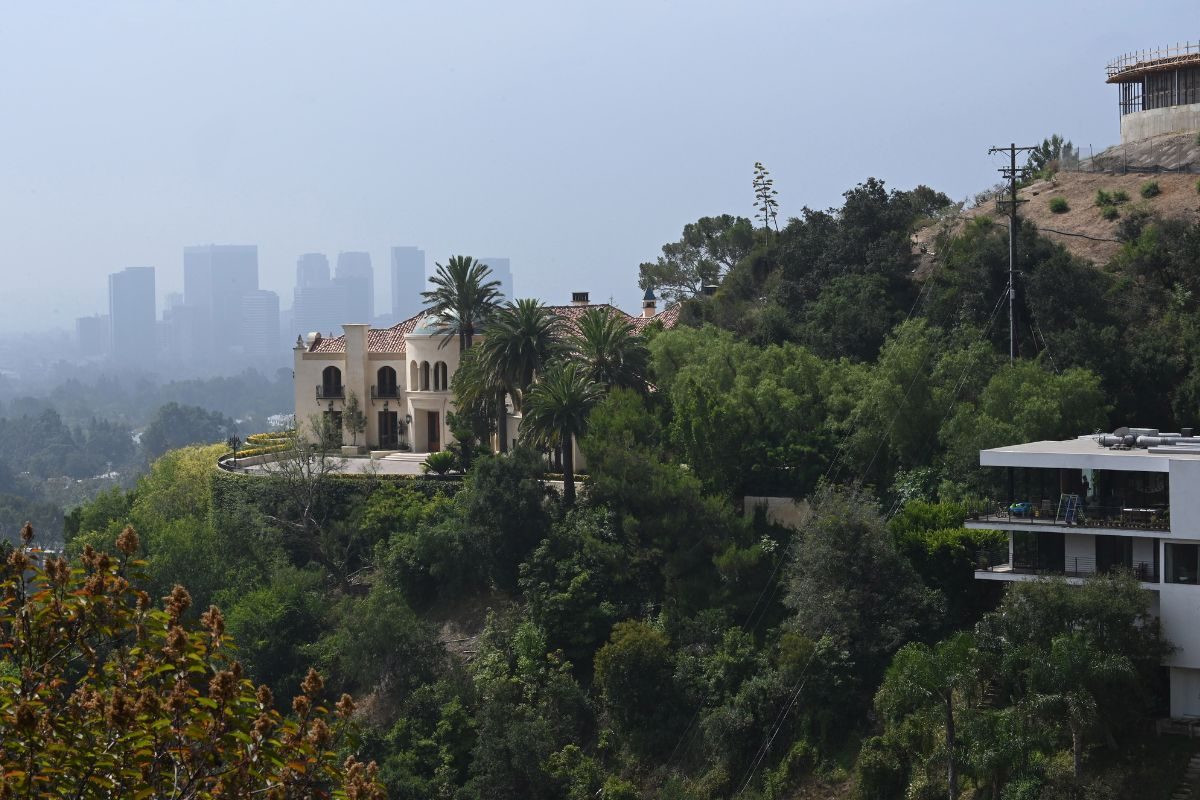 A new home (L), seen August 7, 2019, on Cielo Drive in Beverly Hills, California, has replaced the now razed home in which Sharon Tate and four others were killed by the Manson Family 50 years ago