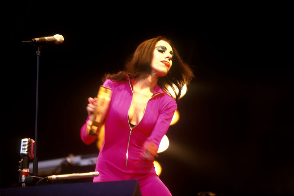 PJ Harvey performing on the Pyramid stage at the 1995 Glastonbury Festival