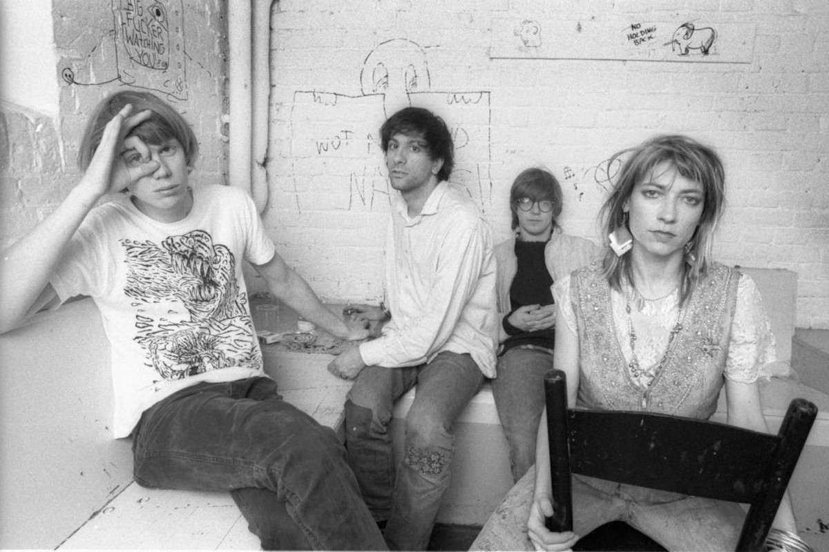 Sonic Youth, (L-R) Thurston Moore, Lee Ranaldo, Steve Shelley and Kim Gordon, posing backstage, 1986