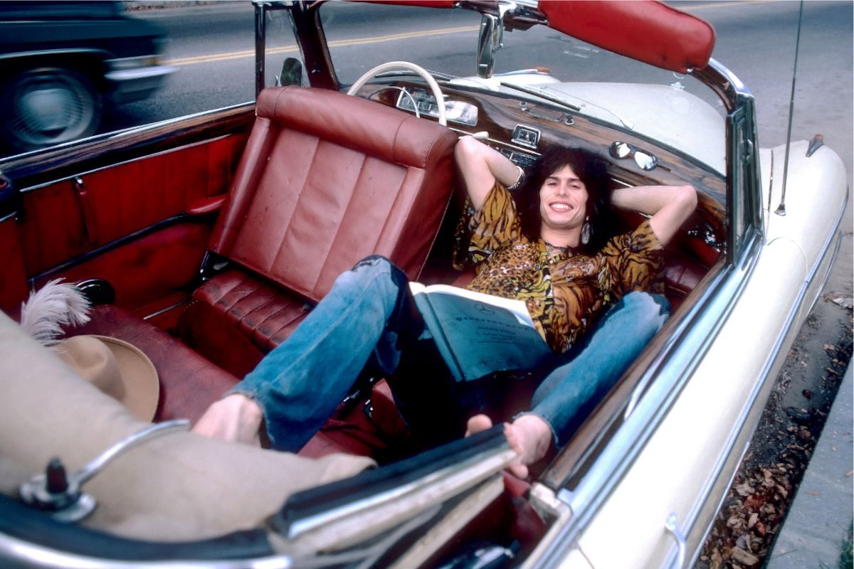 Steven Tyler of rock group Aerosmith in his 1956 Mercedes Benz 220S at Jamaica Pond, Boston MA October 9, 1975