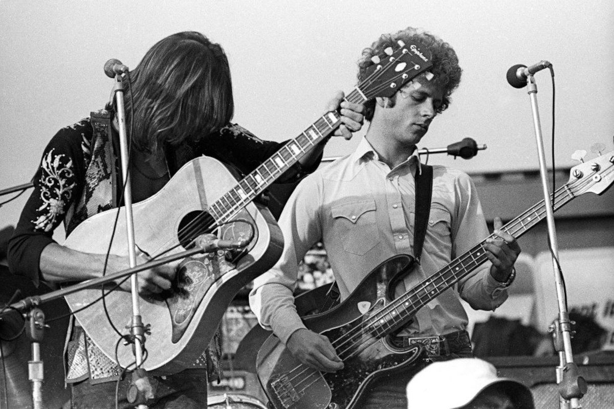 Gram Parsons and Chris Hillman of The Flying Burrito Brothers perform onstage at The Altamont Speedway on December 6, 1969