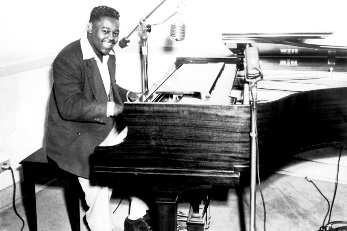 Fats Domino poses for a portrait at the piano, circa 1956
