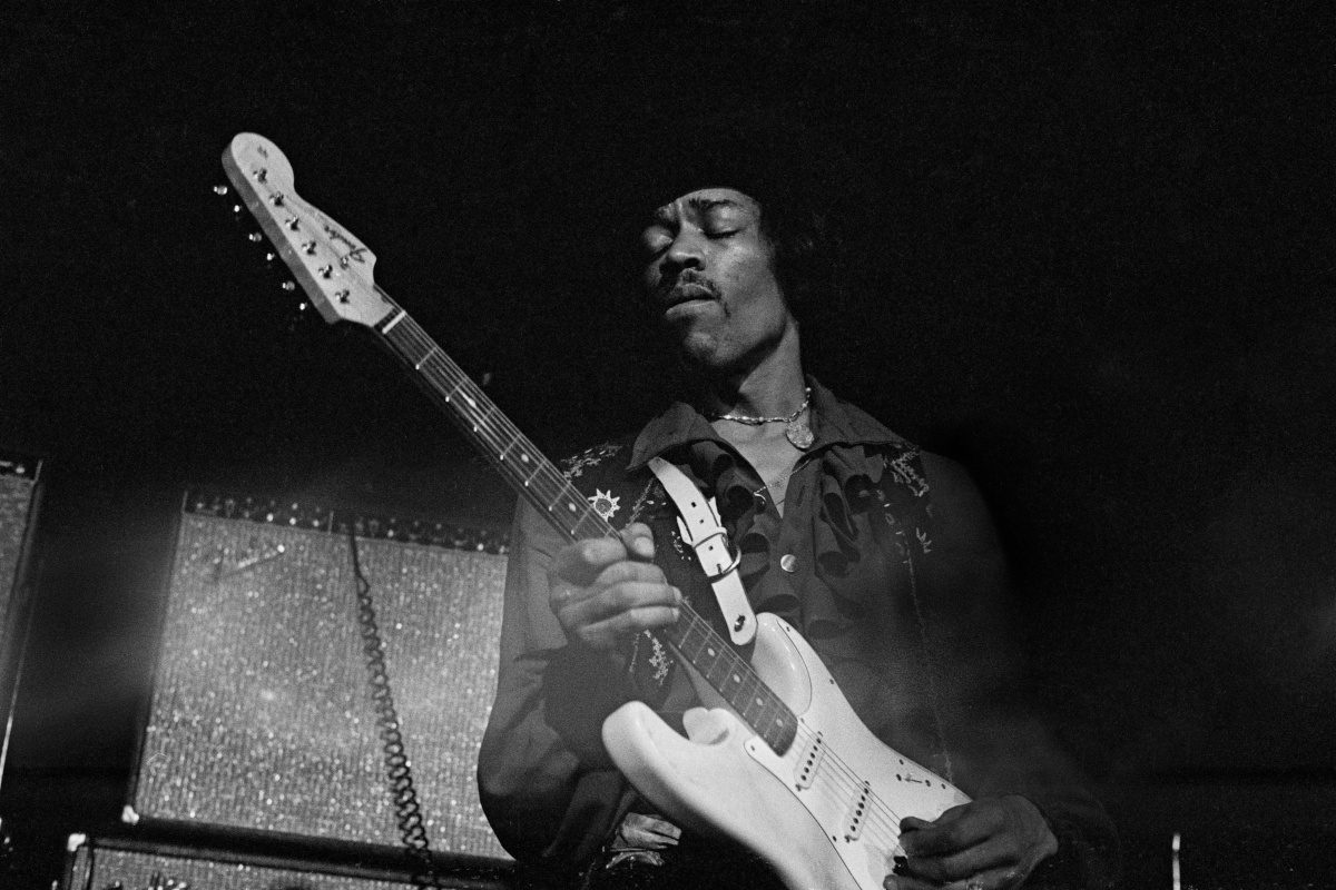 Jimi Hendrix playing a Fender Stratocaster guitar while performing live, 1968