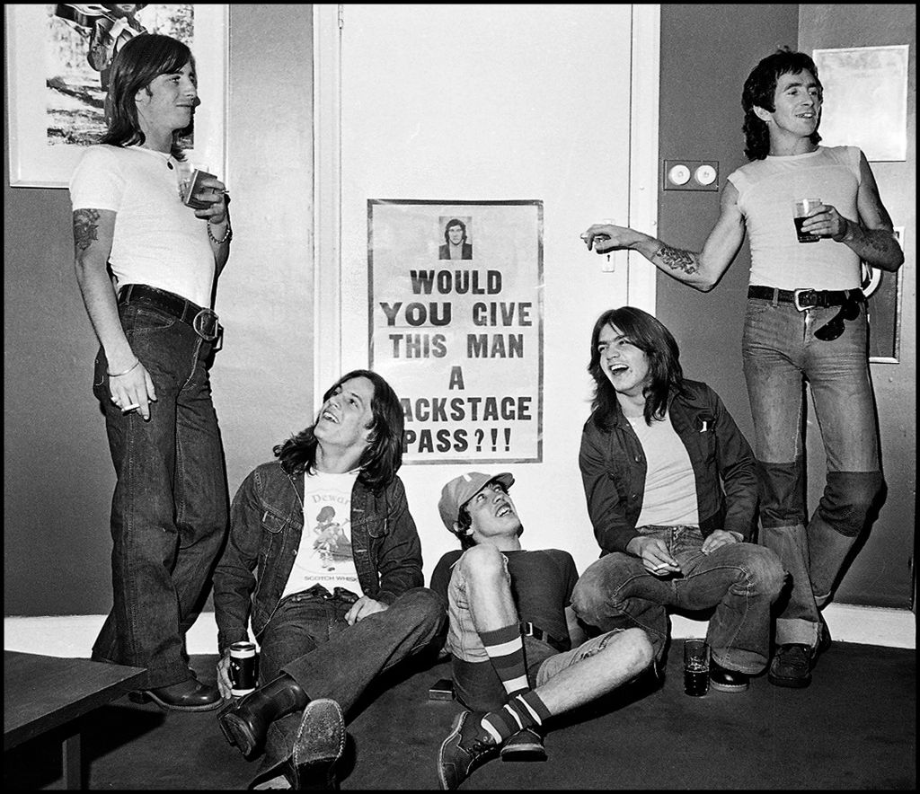 AC/DC at the offices of their record label WEA, 1976. L-R: Phil Rudd, Mark Evans, Angus Young, Malcolm Young, Bon Scott