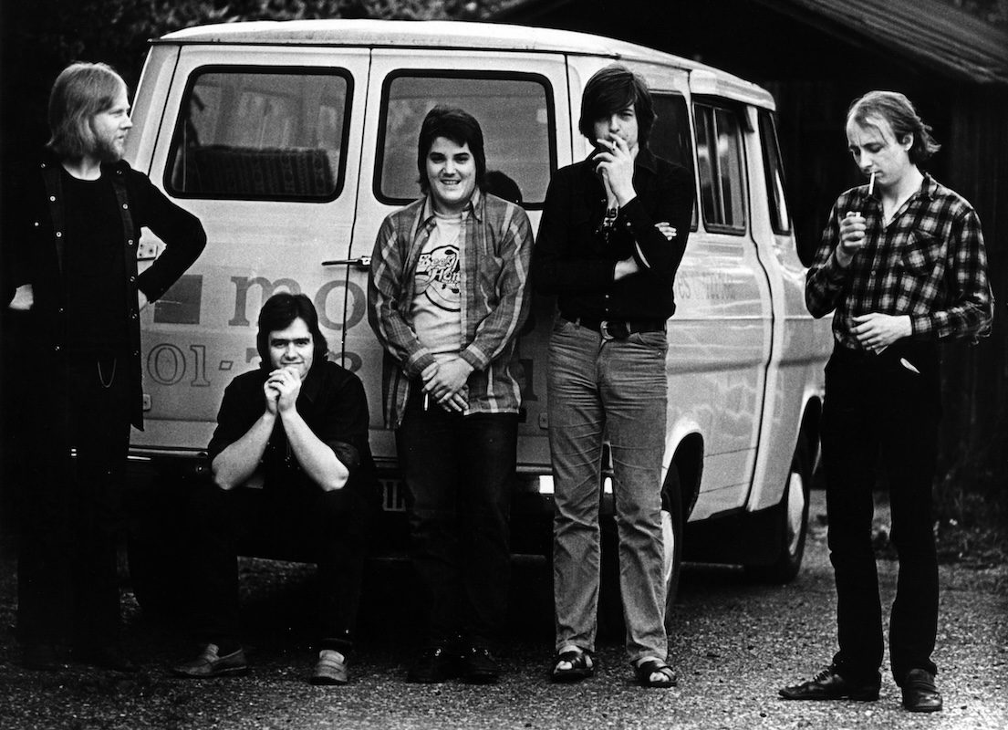 Black and white photo of Brinsley Schwartz posed with transit van