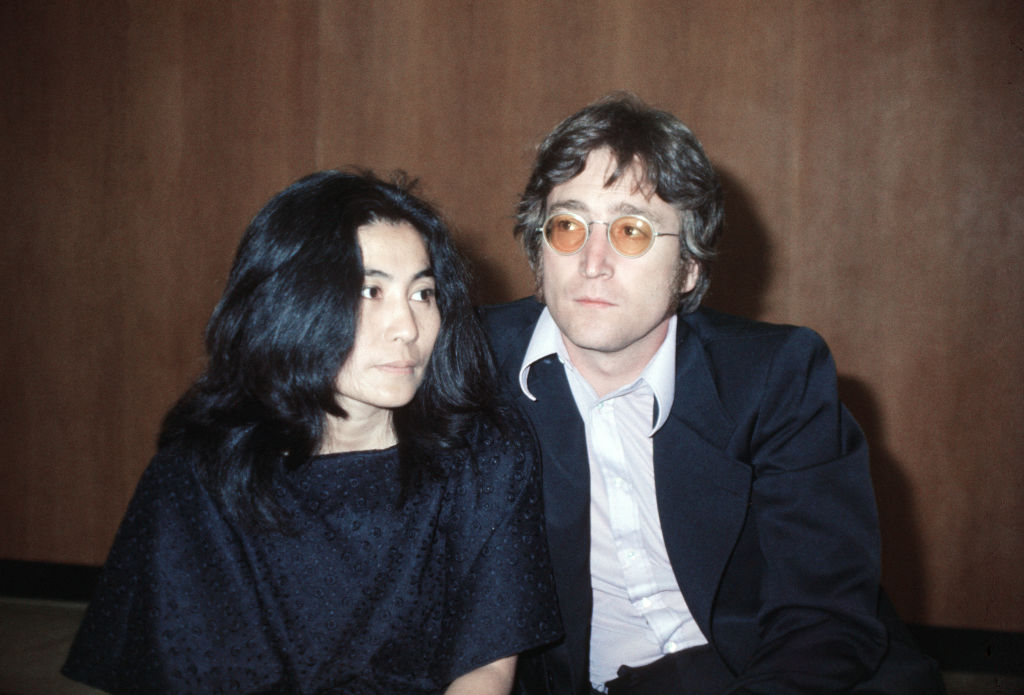 John Lennon with his wife Yoko Ono at Heathrow Airport, London, May 1971