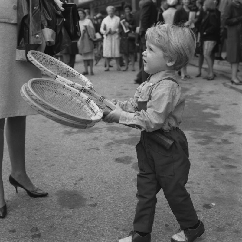 A young Lars Ulrich accompanies his father, Danish tennis player Torben Ulrich, to the Wimbledon tennis championships, London, UK, June 1966